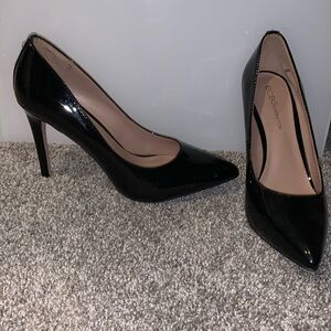 Patent black leather pumps